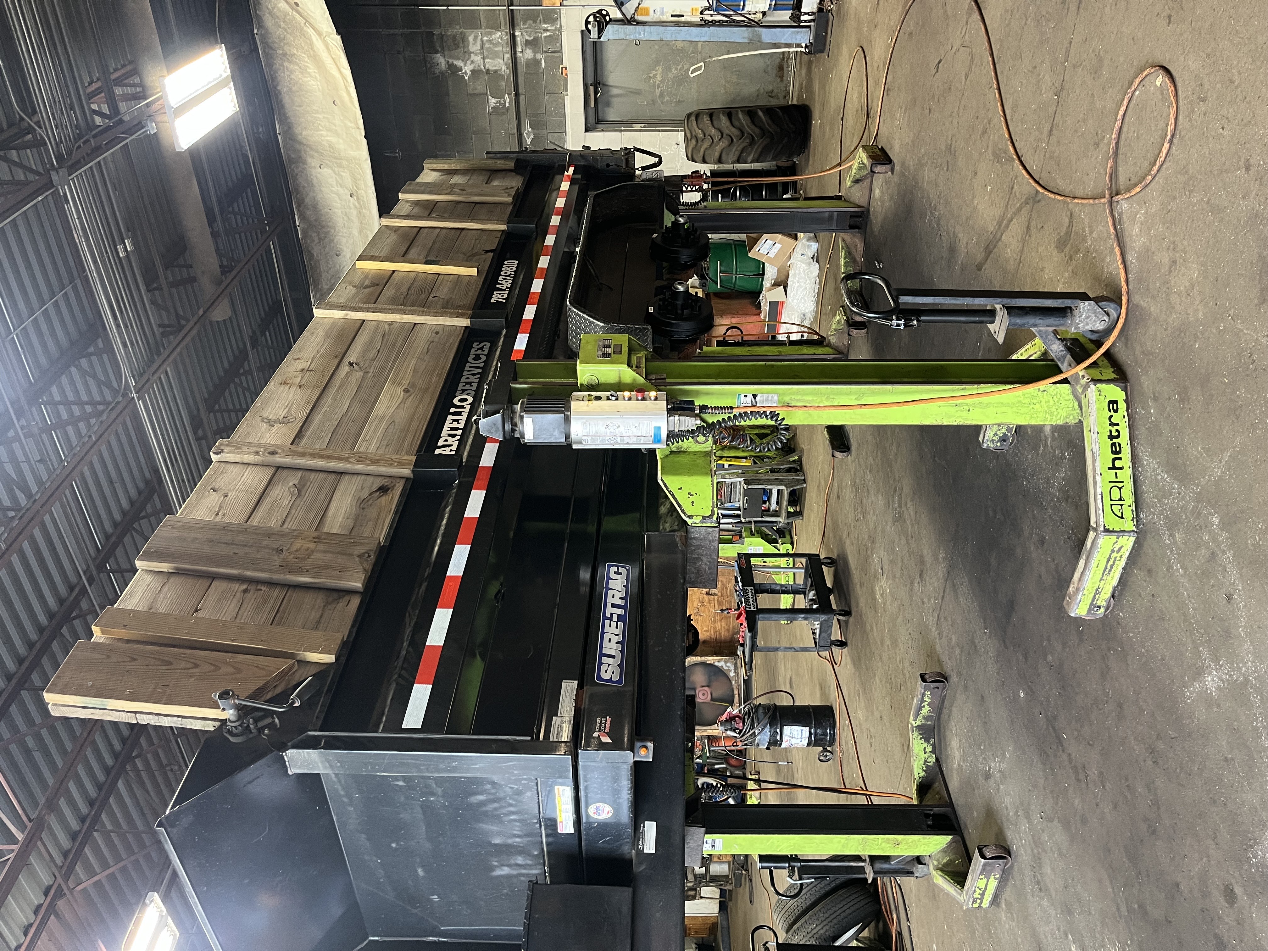 Dump trailer brake and axle service on mobile column lifts at R J Hallisey Truck Repair