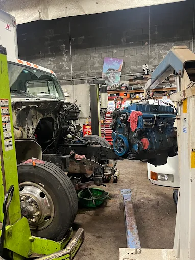 Diesel engine being repaired at truck repair shop near Boston
